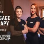 Freatured image for blog 16 of the Best Massage Schools in the US & What to Look For, four women posing and smiling because they attended the best massage school