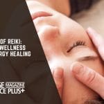 A person receiving a Reiki healing session with a gentle hand placed on their forehead, promoting relaxation and energy healing.
